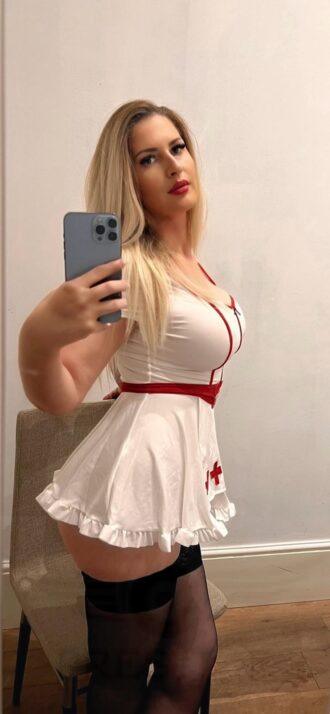 Madeline in her sexy nurse outfit